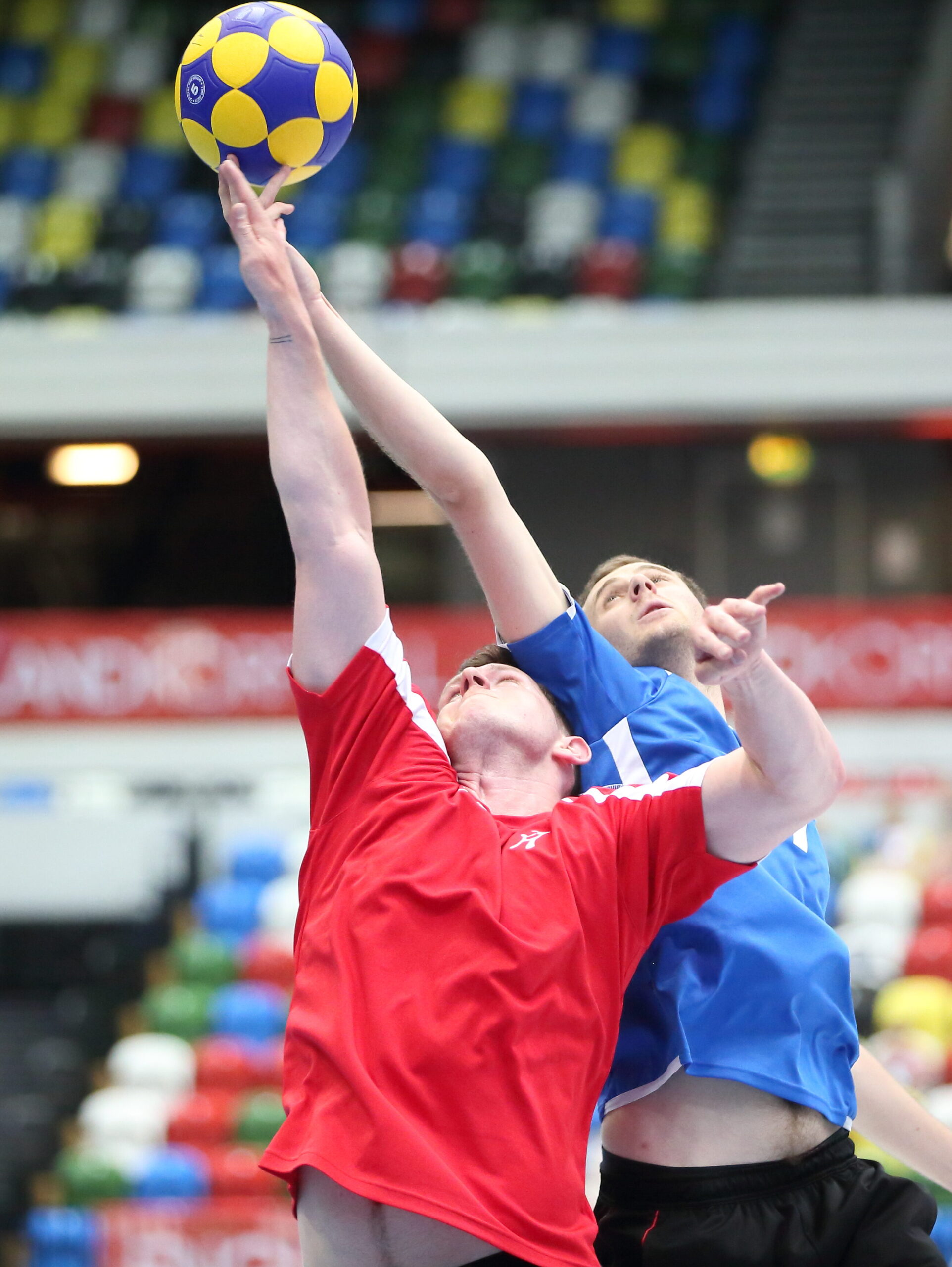 men competing to catch ball